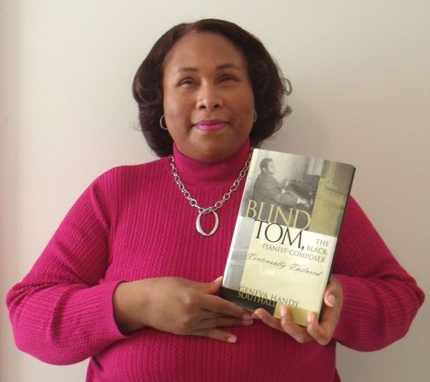 Empish holding book on Blind Tom