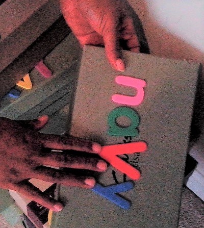 Empish selecting shoes in shoe boxes