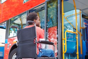 Disabled Black Man in Wheelchair Boarding Bus