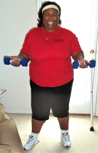 Empish doing arm exercises with hand weights